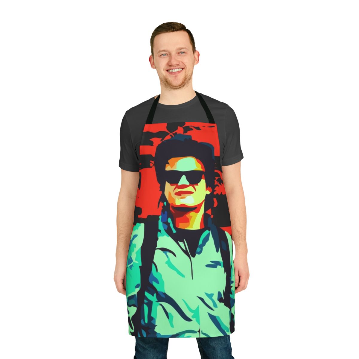 Steve Harrington character from Stranger Things Netflix series wearing an apron with the show's logo and characters.