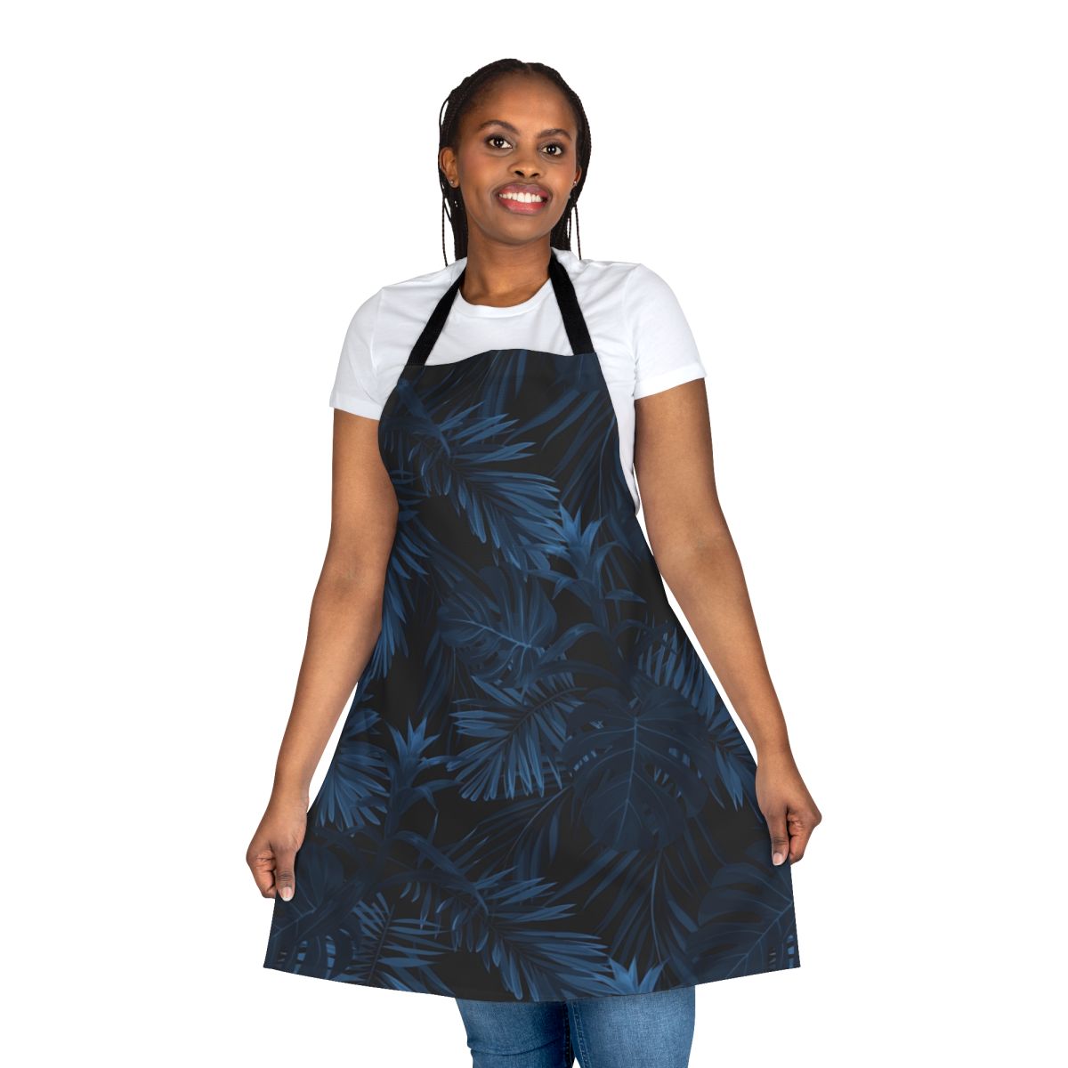 A stylish dark indigo apron featuring tropical floral and leaf patterns.