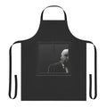 A black and white graphic apron featuring an illustration of the iconic director Alfred Hitchcock.