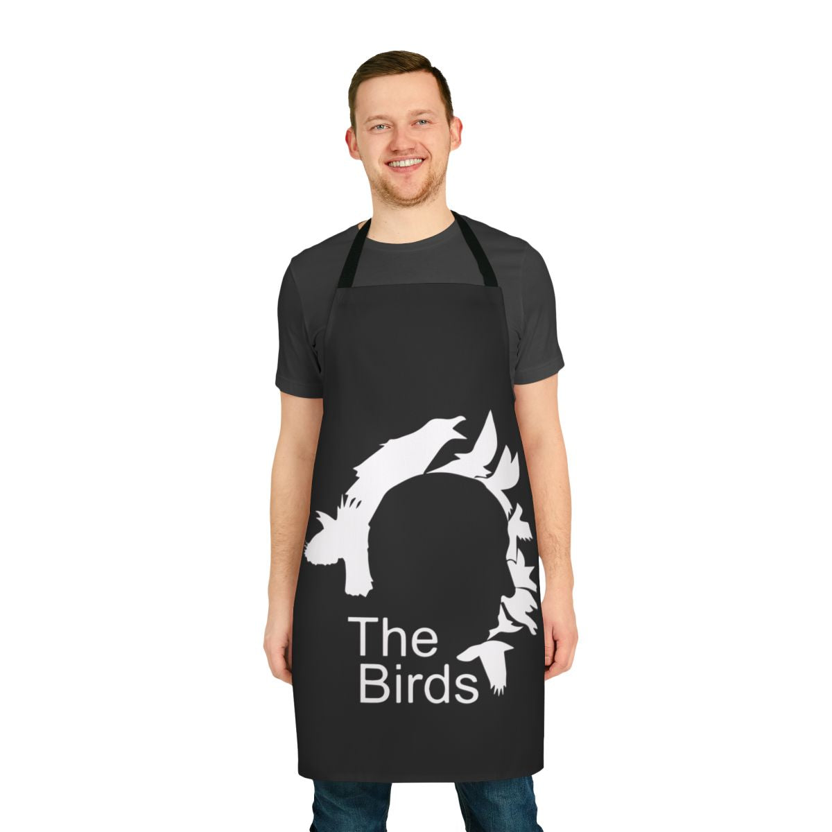 Retro-style apron featuring an illustration of iconic film director Alfred Hitchcock and his classic horror movie "The Birds"