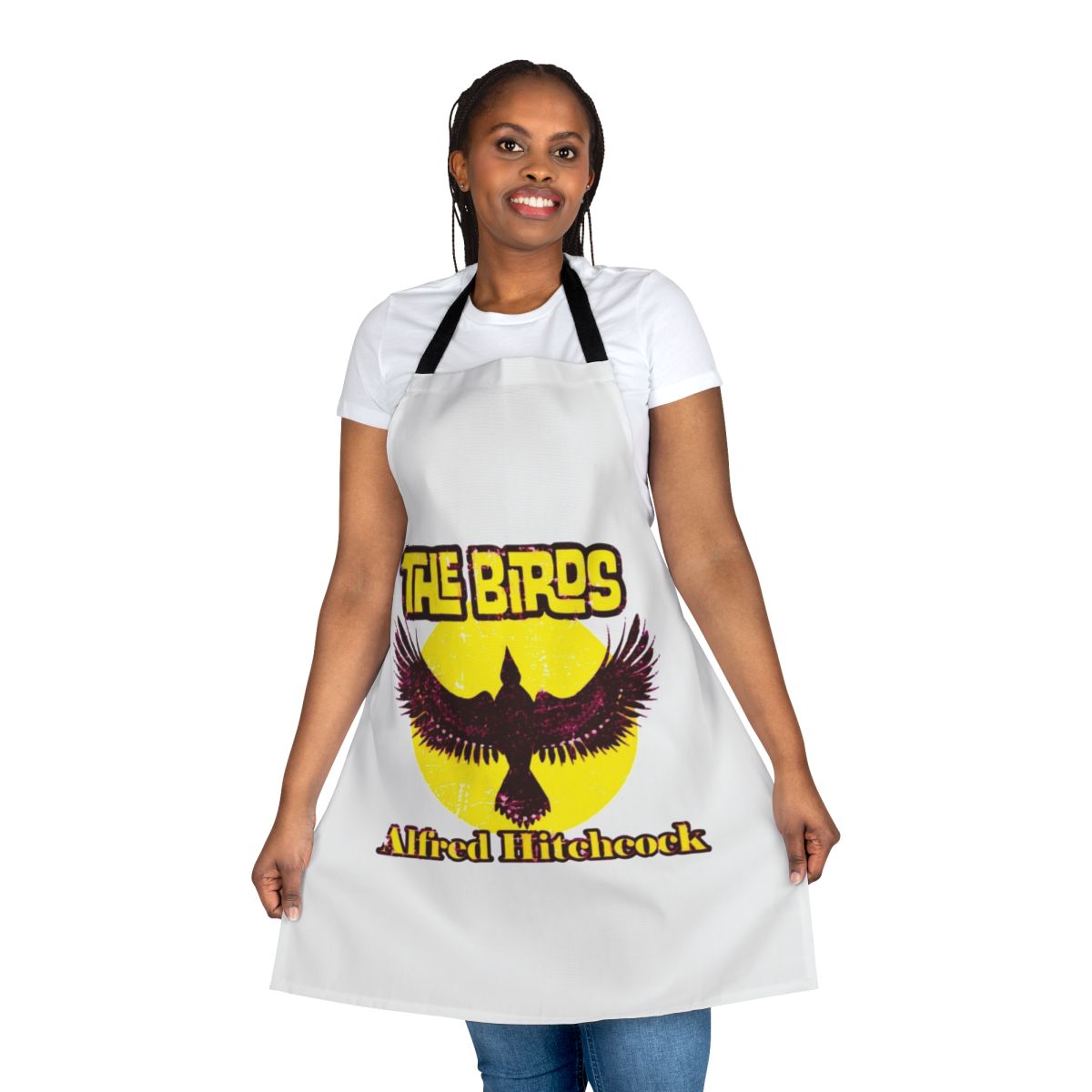 An apron featuring a stylized portrait of Alfred Hitchcock, the legendary film director, and a nod to his classic horror movie "The Birds".