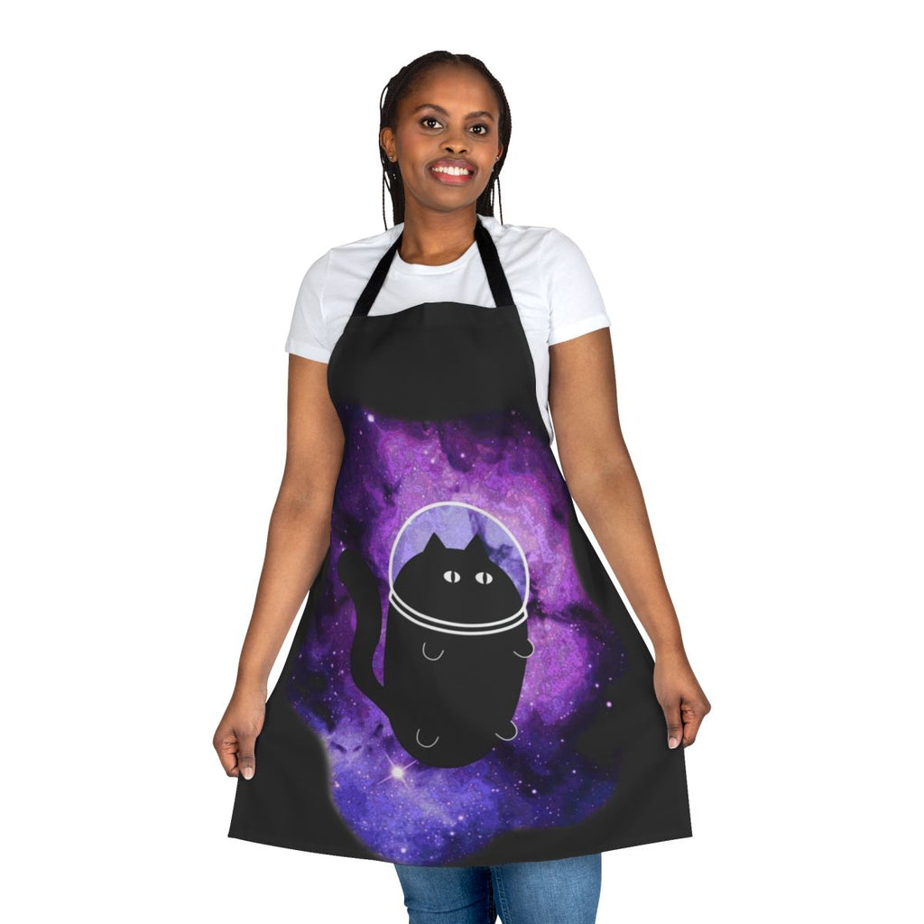 A blue and purple apron with a cartoon cat astronaut design, perfect for space-themed kitchens.