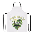 A vibrant apron featuring lush monstera leaves, perfect for plant lovers.