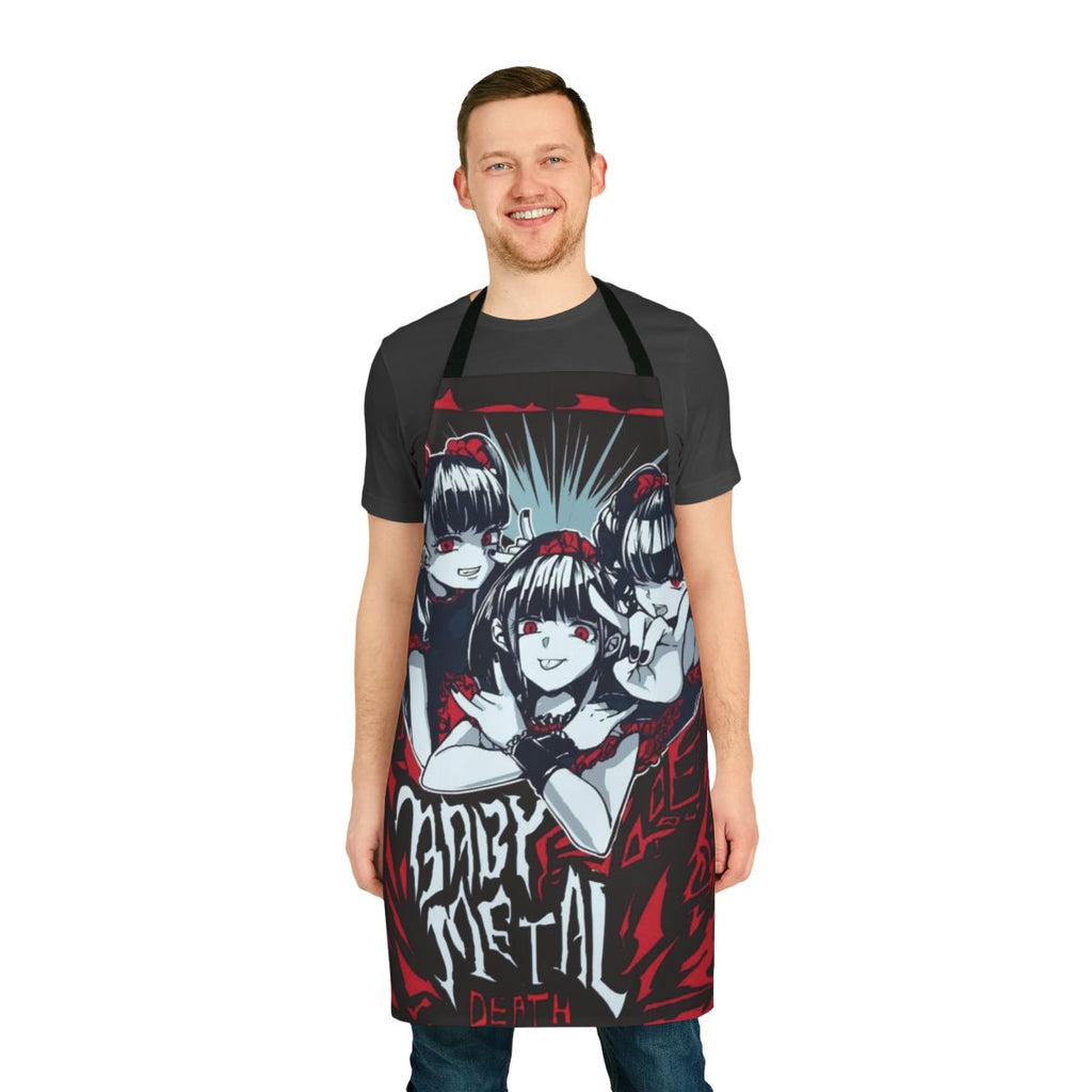 A black apron with a colorful baby metal design, featuring anime-style graphics and heavy metal music imagery.