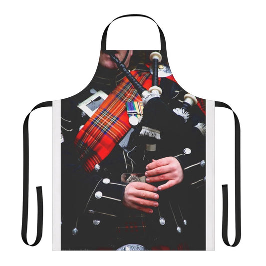 A red tartan apron with a bagpipe design, perfect for enjoying traditional Scottish music and culture.
