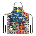 A man wearing a playful bear-themed apron while cooking or grilling
