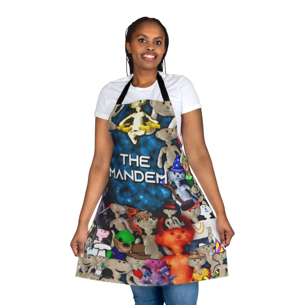 A man wearing a playful bear-themed apron while cooking or grilling