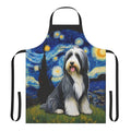 Bearded collie dog wearing a blue apron with a starry night pattern