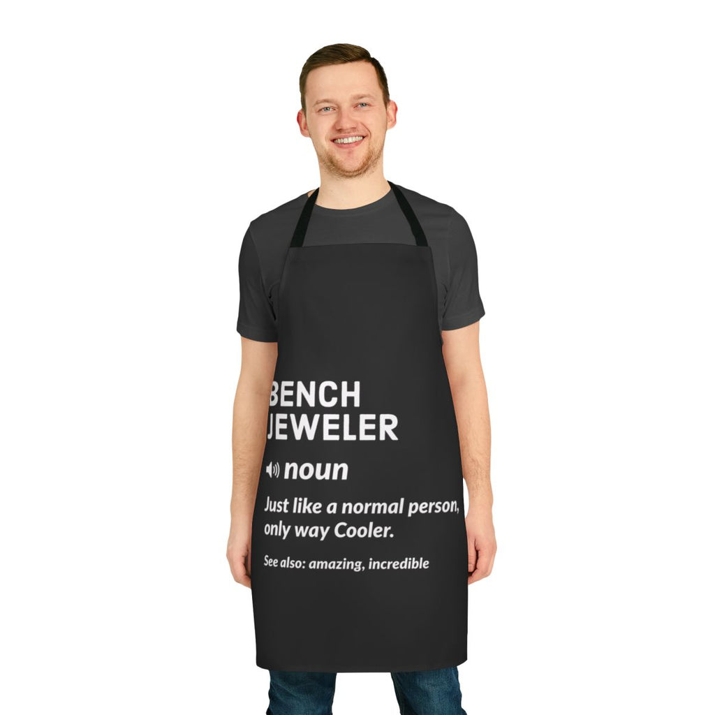 Bench jeweler wearing a stylish apron with jewelry tools and accessories