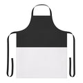 Photograph of a stylish black and white bicolor apron with a geometric design.