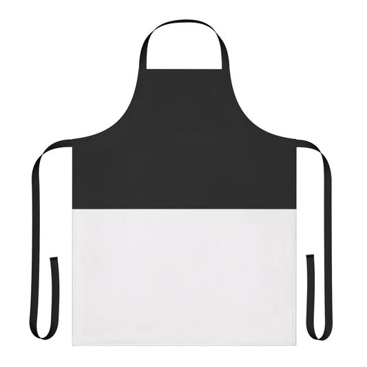 Photograph of a stylish black and white bicolor apron with a geometric design.