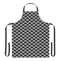Black and white apron with a repeating fish scale geometric pattern