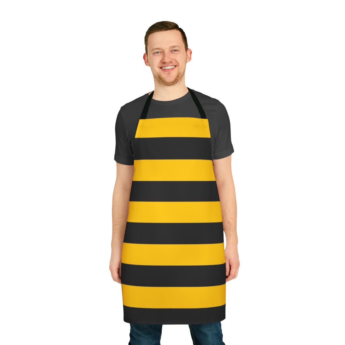 A black and yellow striped apron with a bold, stylized bee pattern design.