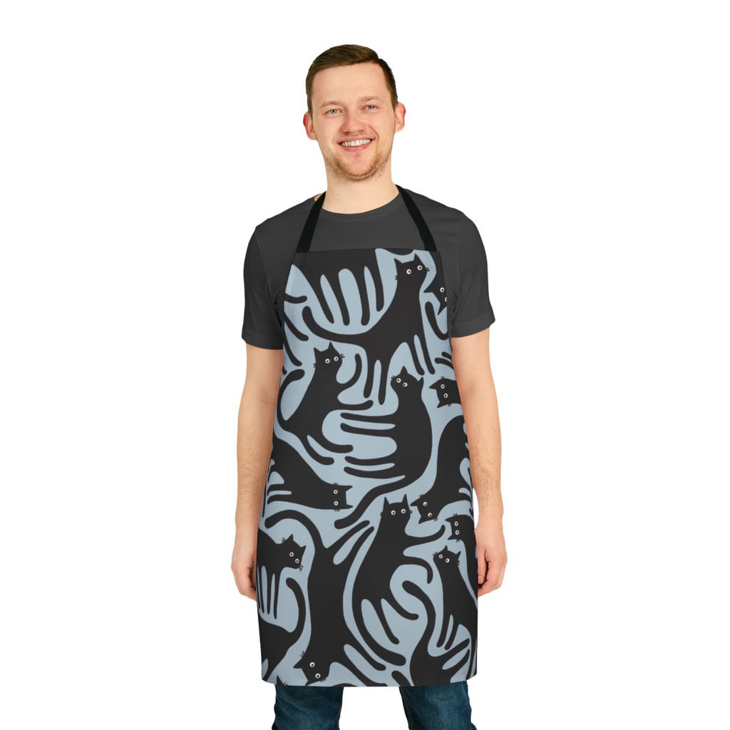 A modern black cat pattern printed on a blue apron, perfect for cat enthusiasts