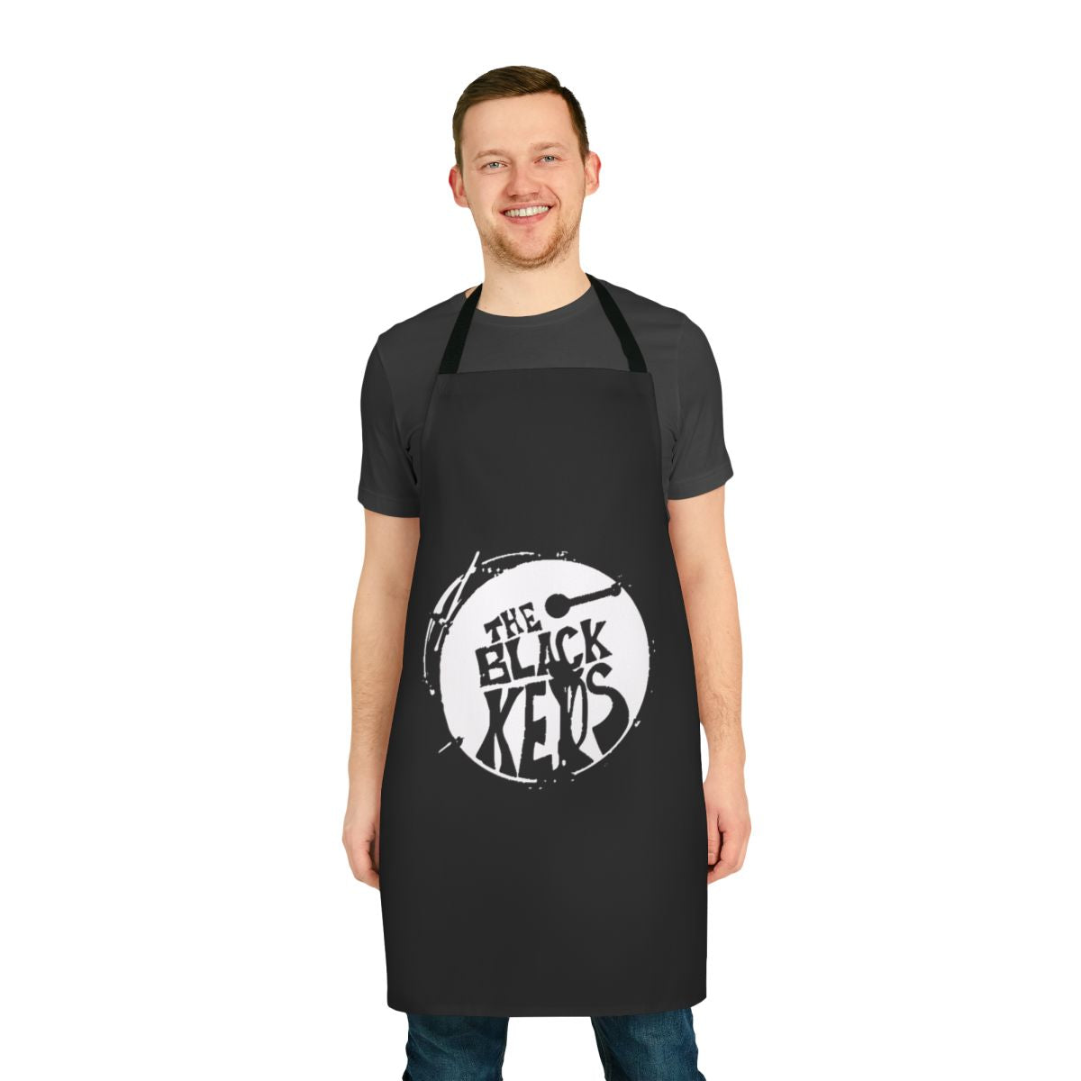 Black and white apron with a stylized round the black keys design