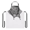 Black and white keffiyeh-patterned apron with tassels