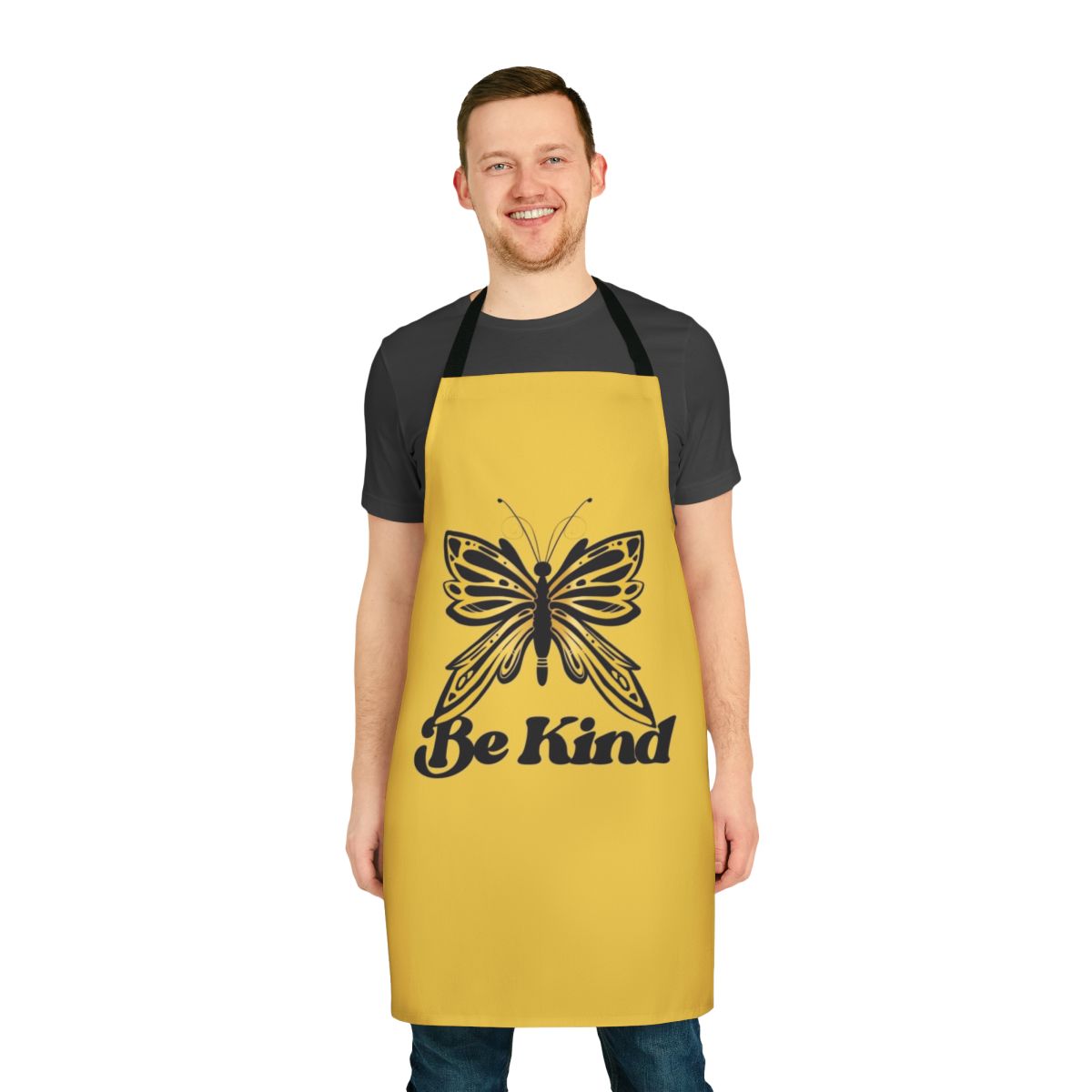 A beautiful butterfly-patterned apron with the message "Be Kind"