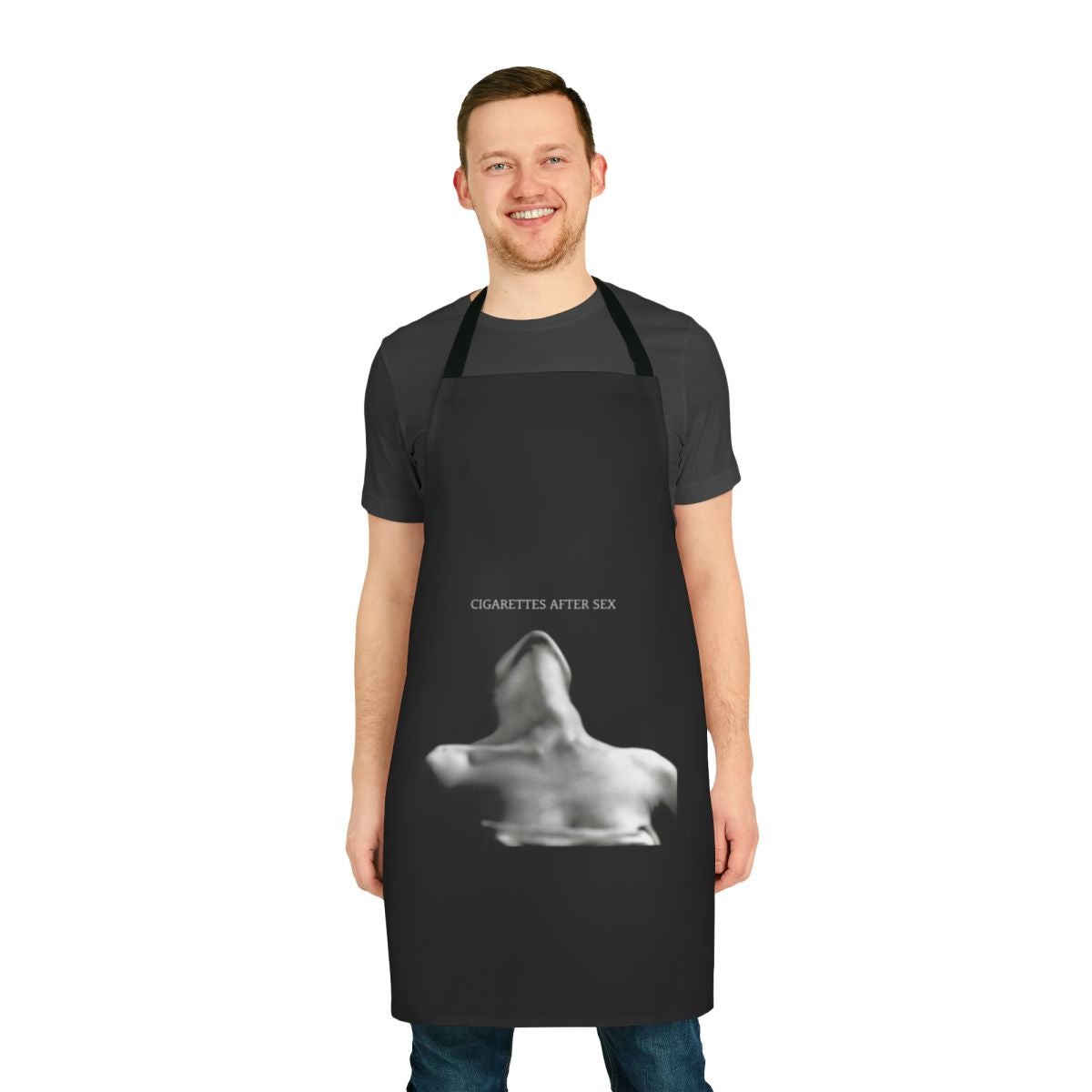 A black apron with the Cigarettes After Sex band logo and aesthetic design, perfect for music lovers and fans.