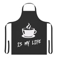 Person wearing a black apron with the text "Coffee Is My Life"
