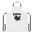 A stylish black apron featuring a corvid design, perfect for witchy cooks and bakers.