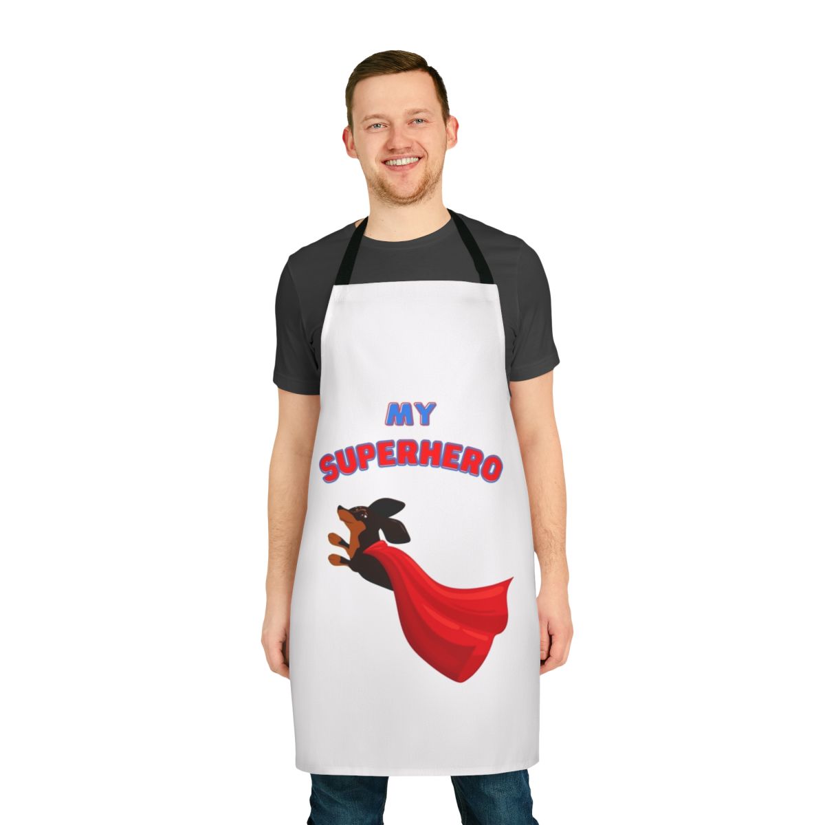 Dachshund wearing a superhero costume on a black and white apron