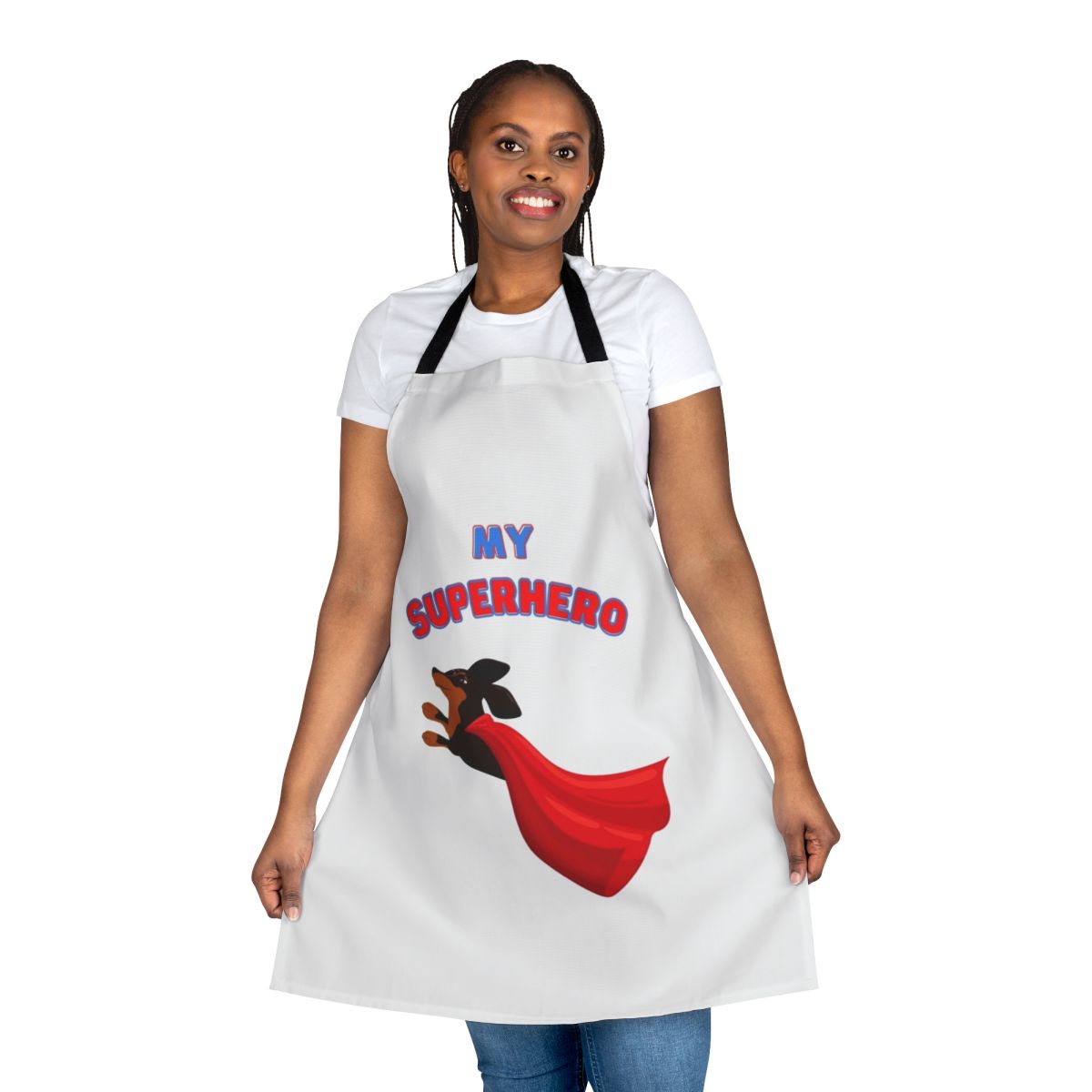 Dachshund wearing a superhero costume on a black and white apron