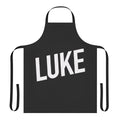 A person wearing a stylish French-style apron with a rock band design.