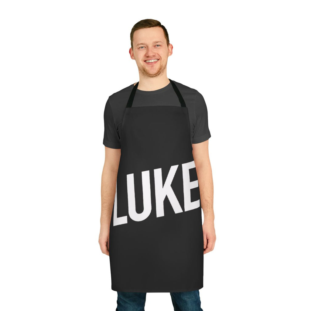 A person wearing a stylish French-style apron with a rock band design.