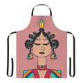 Photograph of a whimsical diva doll-inspired apron with geometric patterns in pink, orange, and blue.