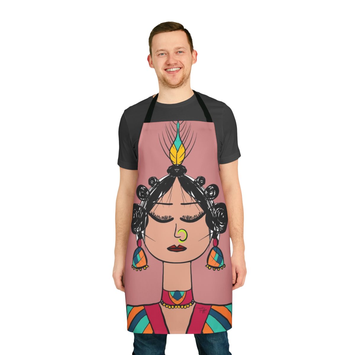 Photograph of a whimsical diva doll-inspired apron with geometric patterns in pink, orange, and blue.
