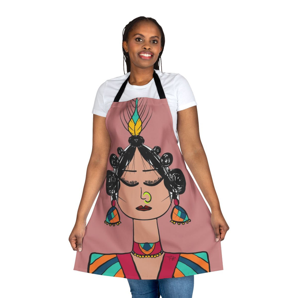 Photograph of a whimsical diva doll-inspired apron with geometric patterns in pink, orange, and blue.