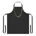 Model wearing a gold chain apron in the kitchen