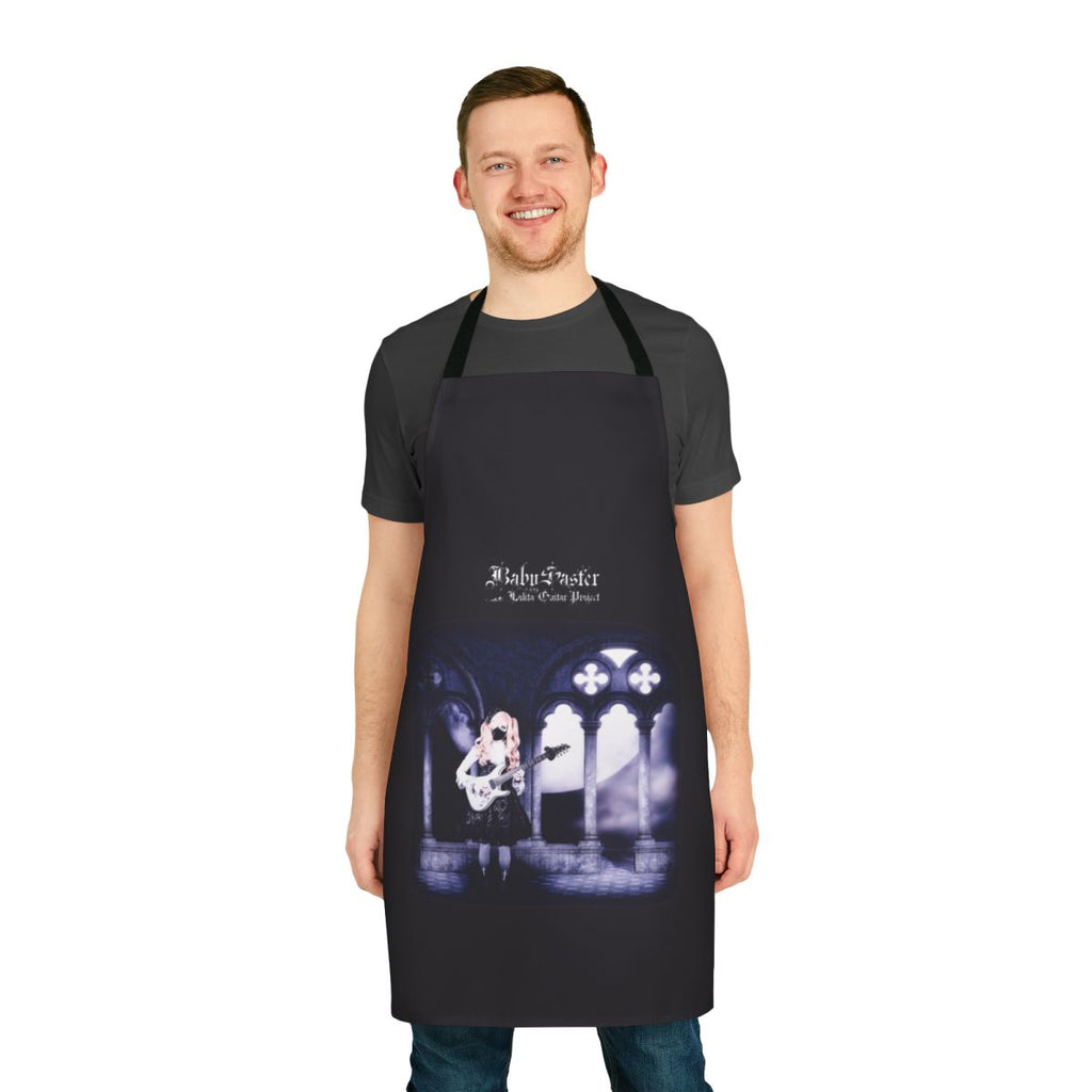 A model wearing a custom gothic lolita-style apron, featuring a toccata guitar design.