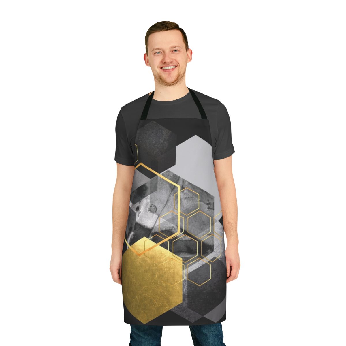 A stylish geometric apron featuring a hexagon pattern in black, white, grey, and gold colors.