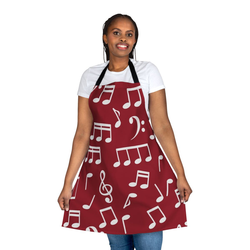 White music notes printed on a red background apron