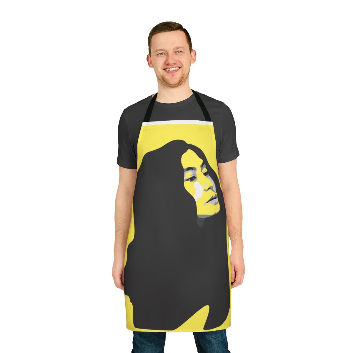 A vibrant yellow apron featuring a stenciled portrait of musician Yoko Ono.