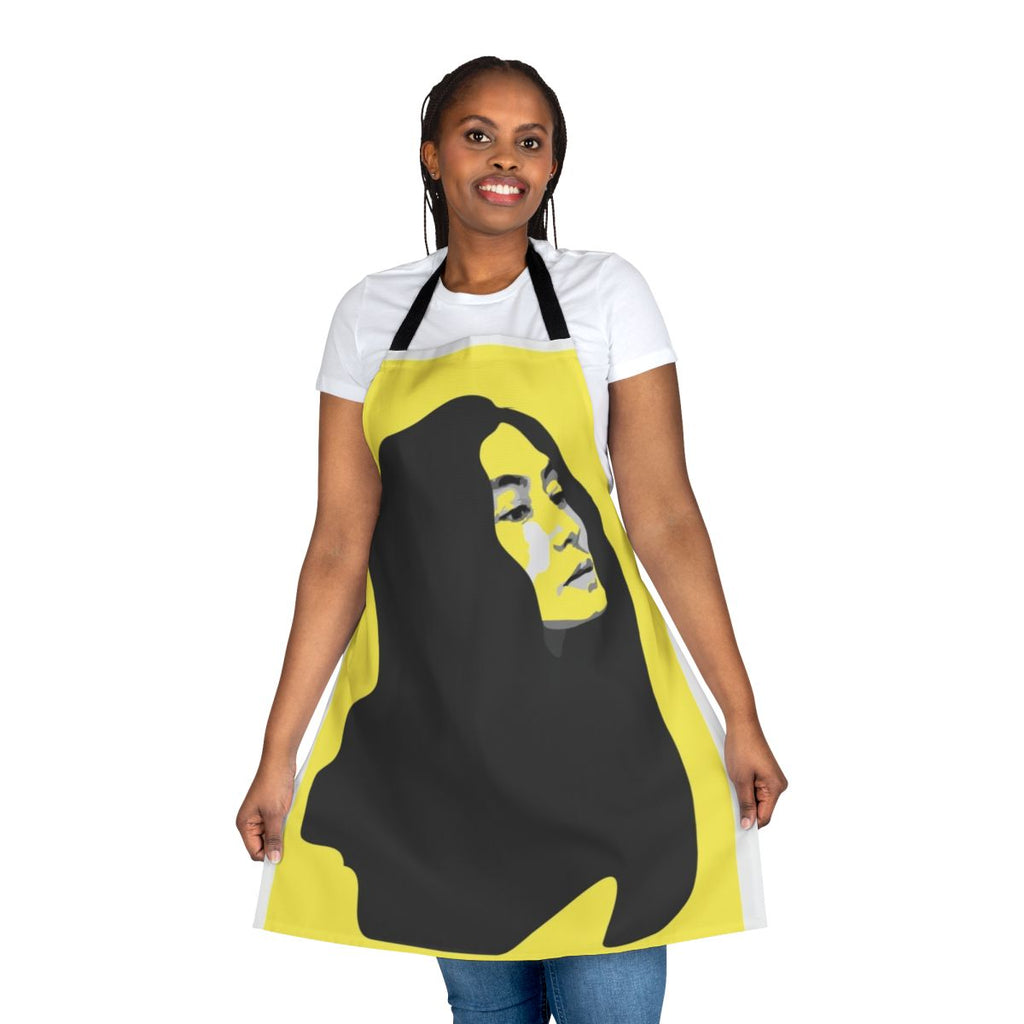 A vibrant yellow apron featuring a stenciled portrait of musician Yoko Ono.