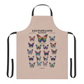 A stylish and fashionable apron featuring a pride flag design with butterflies, perfect for LGBTQ+ kitchen and home.
