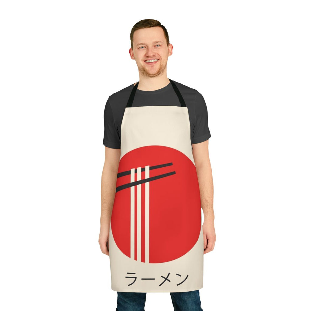 A vibrant, retro-style apron featuring a ramen bowl and kaiju monster design