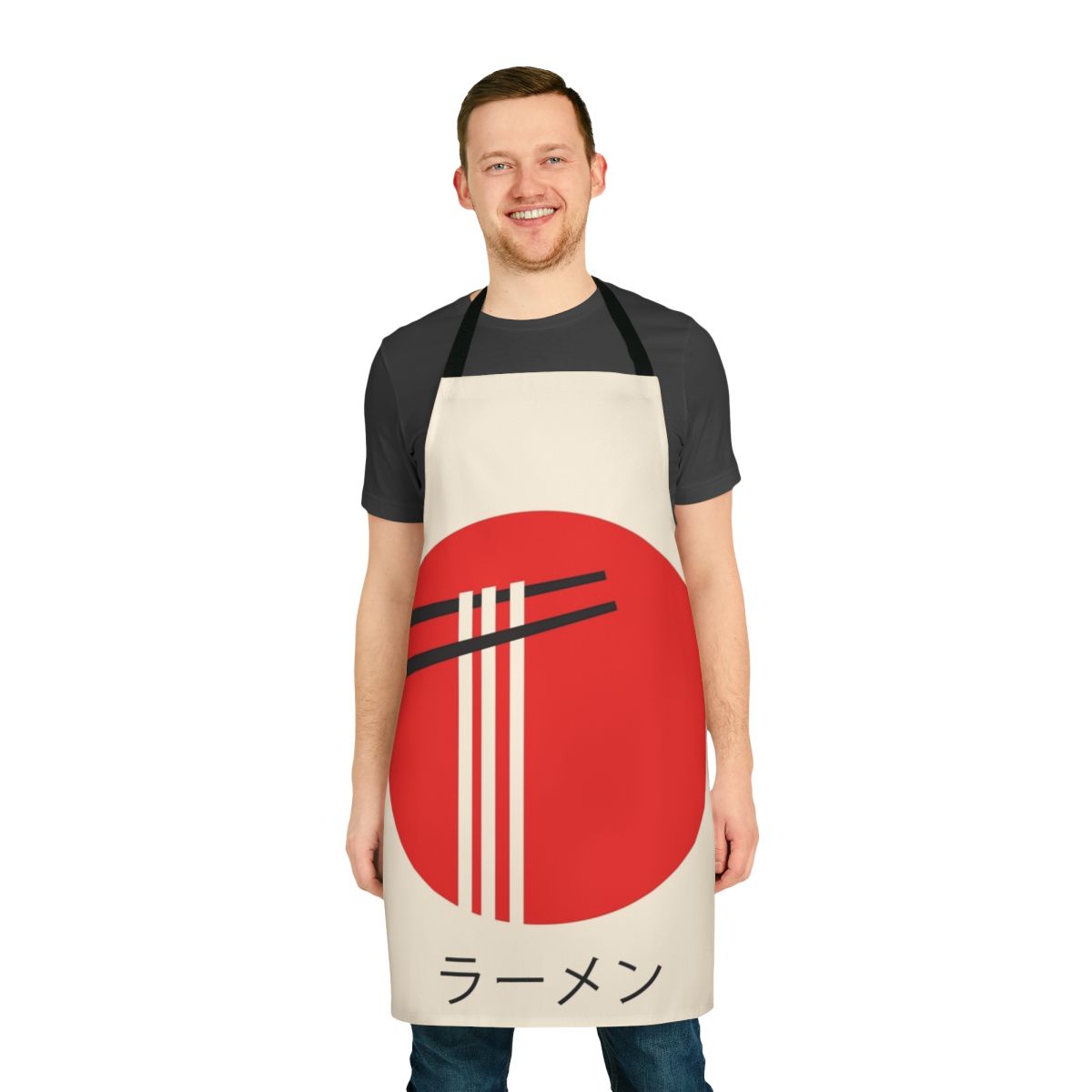 A vibrant, retro-style apron featuring a ramen bowl and kaiju monster design