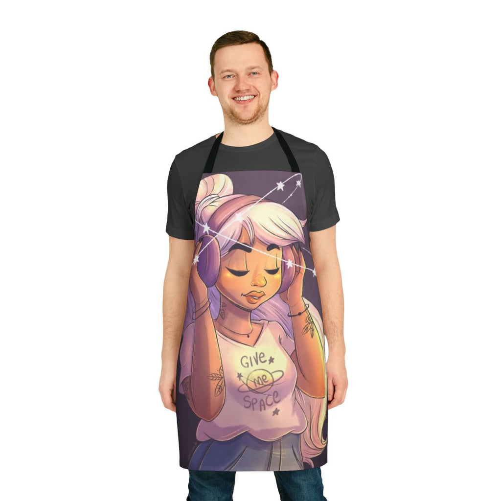 Image of a woman wearing a space-themed apron with stars, galaxies, and an astronaut design