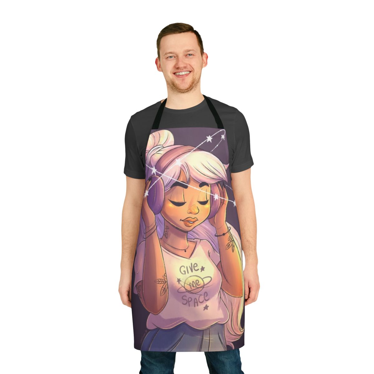 Image of a woman wearing a space-themed apron with stars, galaxies, and an astronaut design