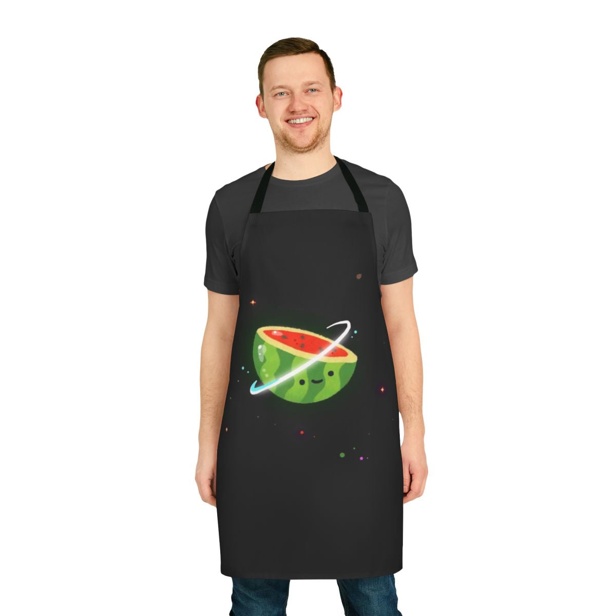 A colorful apron featuring a kawaii watermelon character surrounded by stars and planets