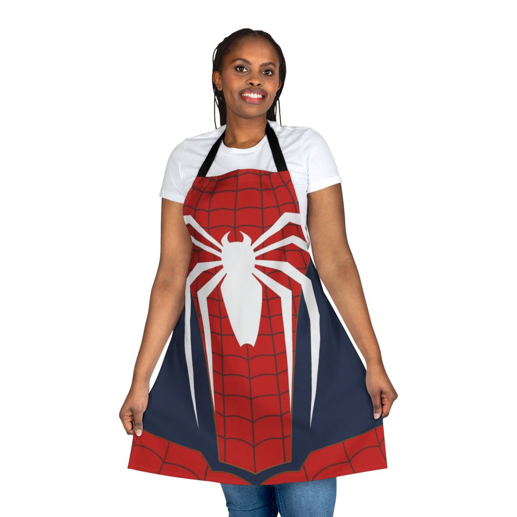 A white apron with a spiderweb design, perfect for the superhero-inspired home cook.