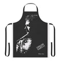 A white and black apron featuring a sun rising over a city skyline design.