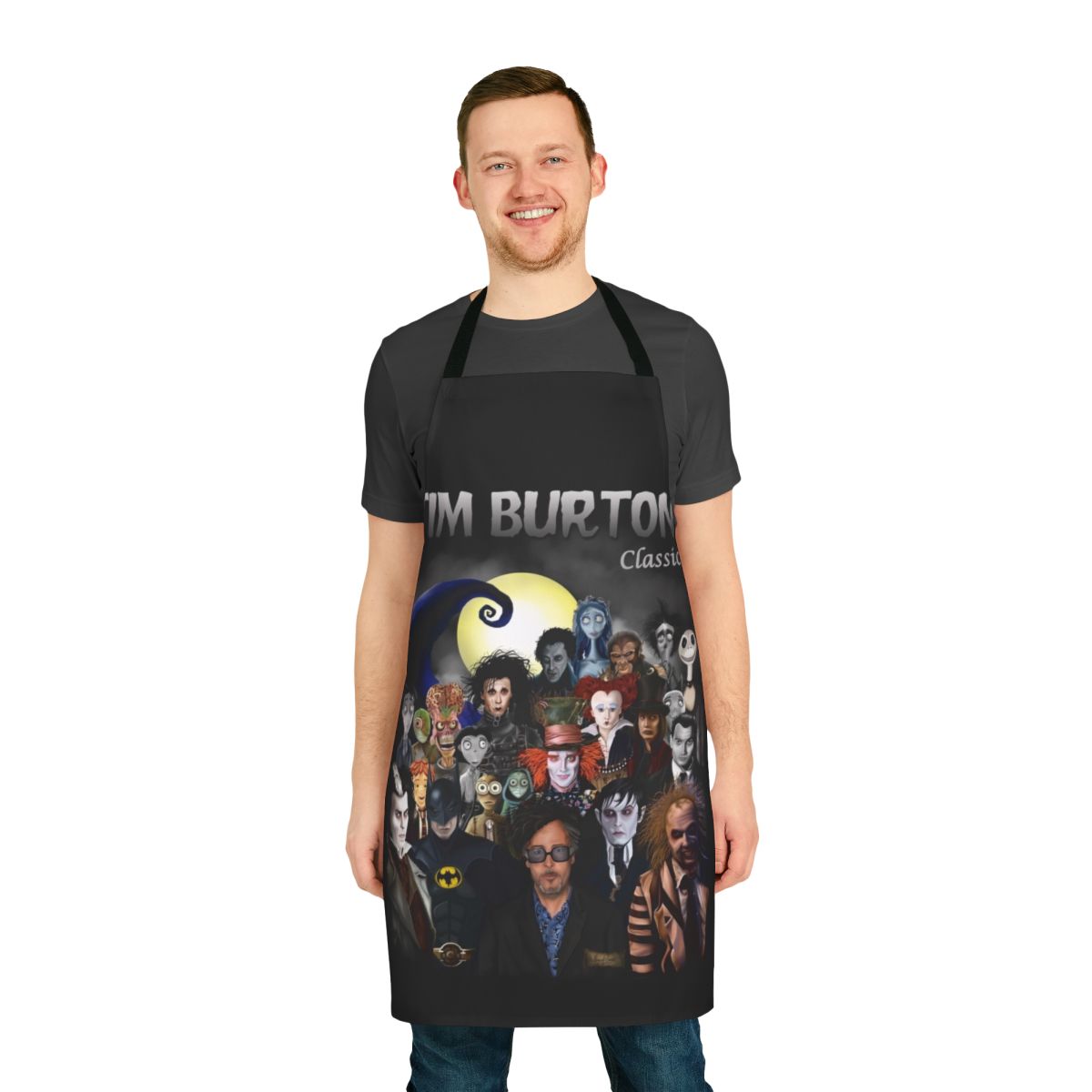 A colorful apron featuring a Tim Burton-inspired gothic and horror-themed design
