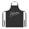 A black apron with the Trapstar brand logo and "Strike Out" text, perfect for cooking and baking.