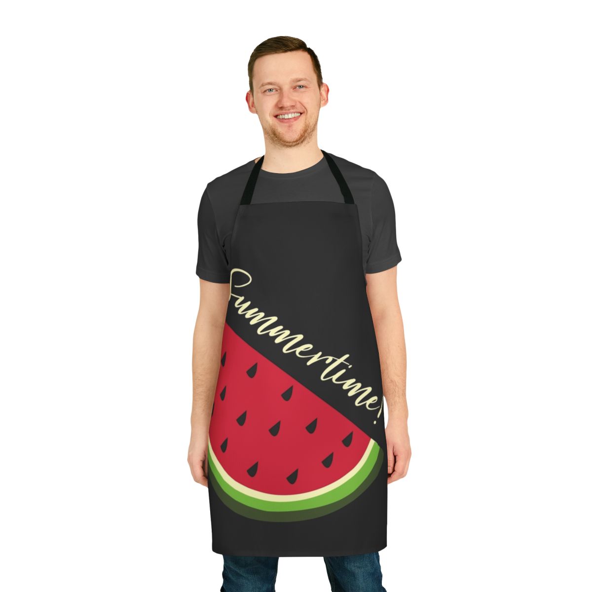 Black apron with vibrant watermelon design, perfect for summer kitchens and barbecues.