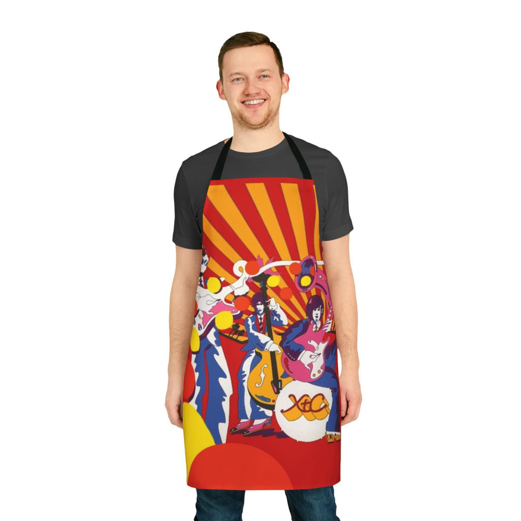 Man wearing a stylish XTC apron while cooking in the kitchen