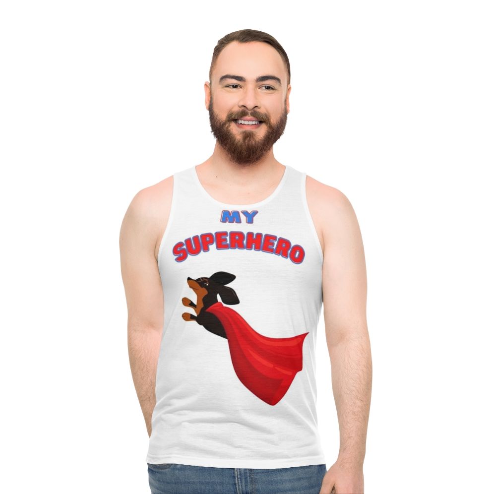 Superhero dachshund wearing a black tank top